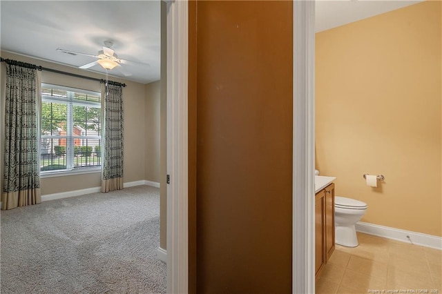 239 Nandina Ct Unit 21A, Fayetteville, NC 28311 - bathroom with vanity, baseboards, toilet, and ceiling fan