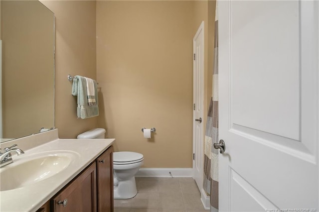 239 Nandina Ct Unit 21A, Fayetteville, NC 28311 - bathroom with tile patterned flooring, toilet, vanity, and baseboards