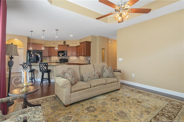 239 Nandina Ct Unit 21A, Fayetteville, NC 28311 - living area featuring ceiling fan, baseboards, and wood finished floors