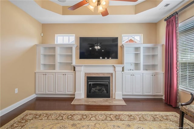 239 Nandina Ct Unit 21A, Fayetteville, NC 28311 - unfurnished living room featuring ceiling fan, dark wood-style flooring, a glass covered fireplace, and baseboards