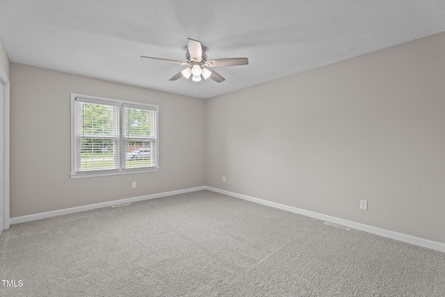 206 Bryant Cir, Goldsboro, NC 27534 - empty room with a ceiling fan, baseboards, carpet, and a textured ceiling