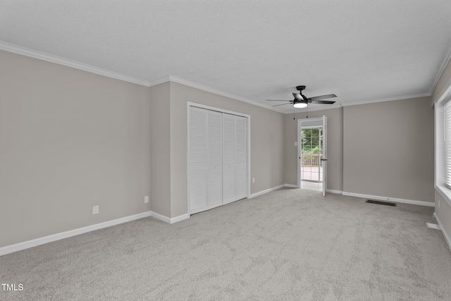 206 Bryant Cir, Goldsboro, NC 27534 - unfurnished bedroom with carpet floors, a closet, ornamental molding, baseboards, and ceiling fan