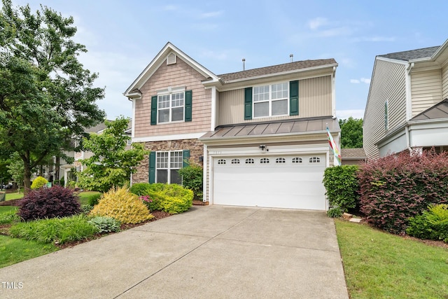 7873 Cape Charles Dr, Raleigh, NC 27617 - traditional-style house featuring an attached garage, concrete driveway, a standing seam roof, a metal roof, and stone siding