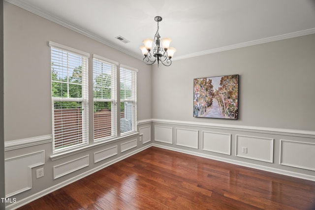 7873 Cape Charles Dr, Raleigh, NC 27617 - unfurnished room featuring a chandelier, ornamental molding, dark wood-style flooring, wainscoting, and a decorative wall