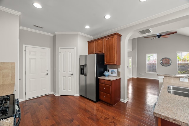 7873 Cape Charles Dr, Raleigh, NC 27617 - kitchen with stainless steel refrigerator with ice dispenser, a ceiling fan, dark wood-style floors, brown cabinetry, and recessed lighting