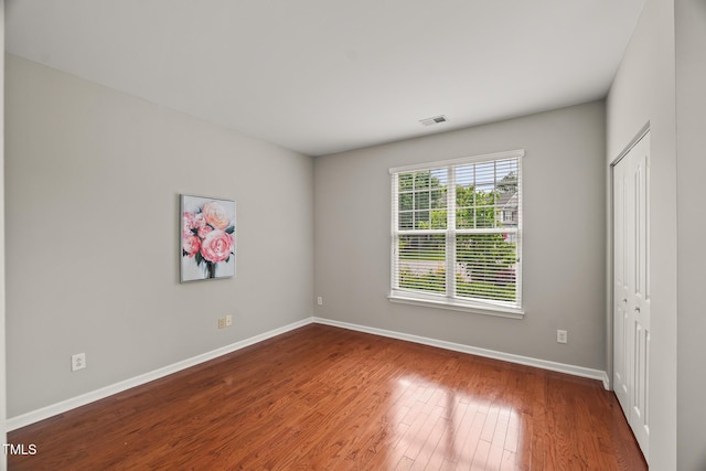 7873 Cape Charles Dr, Raleigh, NC 27617 - unfurnished room with baseboards and wood finished floors