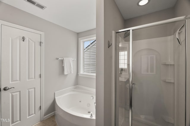 7873 Cape Charles Dr, Raleigh, NC 27617 - full bathroom with a shower stall, a whirlpool tub, and tile patterned floors