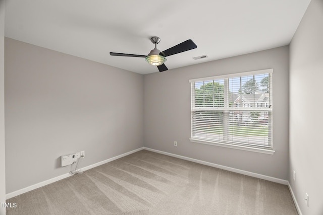7873 Cape Charles Dr, Raleigh, NC 27617 - unfurnished room featuring a ceiling fan and light carpet