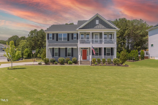 470 E Wellesley Dr, Clayton, NC 27520 - view of front of home featuring a porch, board and batten siding, and a lawn