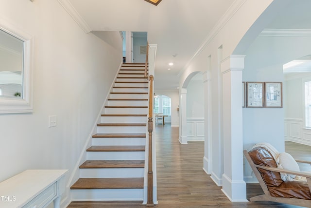 470 E Wellesley Dr, Clayton, NC 27520 - stairs featuring arched walkways, plenty of natural light, crown molding, wood finished floors, and ornate columns