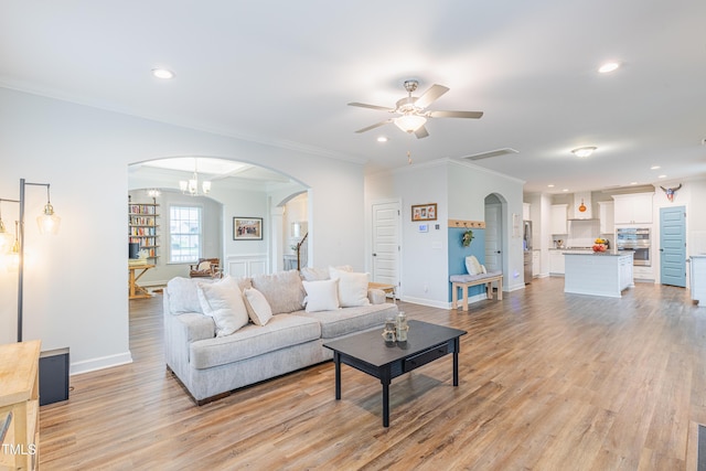 470 E Wellesley Dr, Clayton, NC 27520 - living room with arched walkways, a ceiling fan, light wood-type flooring, recessed lighting, and ornamental molding
