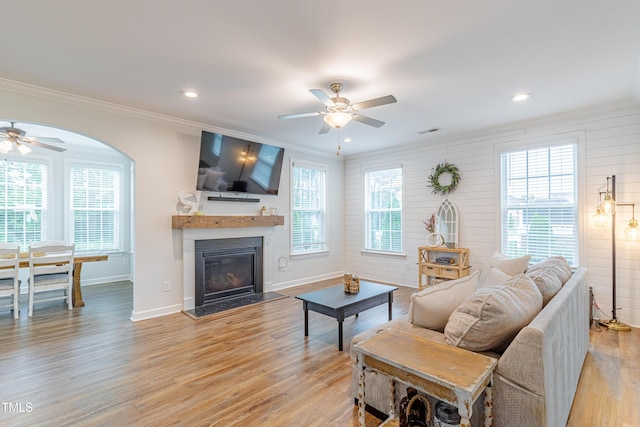 470 E Wellesley Dr, Clayton, NC 27520 - living area with ceiling fan, crown molding, light wood-style flooring, a glass covered fireplace, and recessed lighting