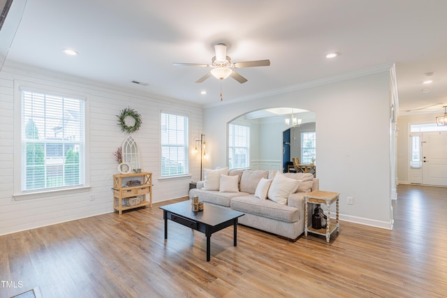 470 E Wellesley Dr, Clayton, NC 27520 - living room with arched walkways, light wood finished floors, crown molding, a ceiling fan, and recessed lighting