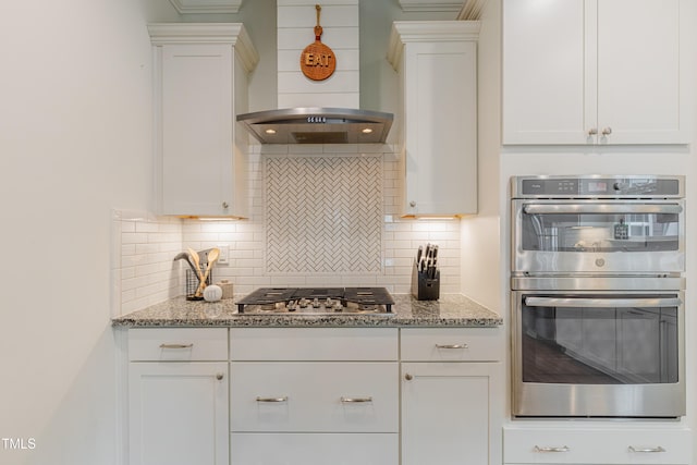 470 E Wellesley Dr, Clayton, NC 27520 - kitchen with stainless steel appliances, wall chimney range hood, and white cabinets