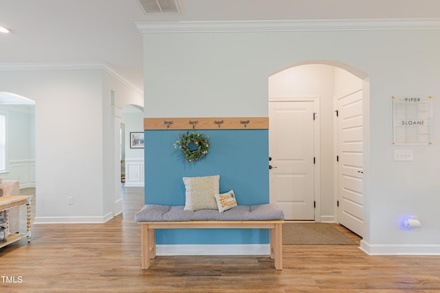 470 E Wellesley Dr, Clayton, NC 27520 - hall featuring crown molding, light wood-style flooring, and arched walkways