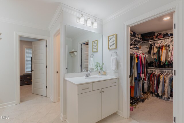 470 E Wellesley Dr, Clayton, NC 27520 - bathroom with vanity, crown molding, a spacious closet, and tile patterned floors