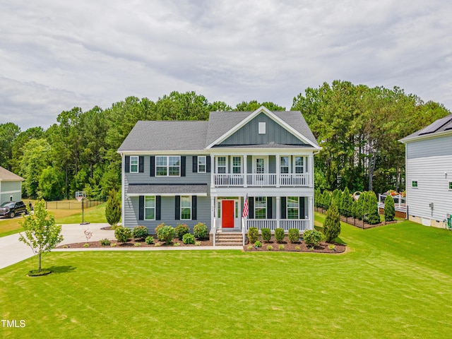470 E Wellesley Dr, Clayton, NC 27520 - view of front of home featuring covered porch, board and batten siding, a front lawn, and concrete driveway