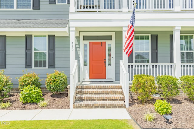 470 E Wellesley Dr, Clayton, NC 27520 - doorway to property featuring a balcony, a shingled roof, and covered porch