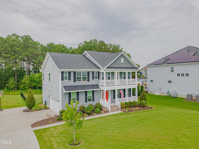 470 E Wellesley Dr, Clayton, NC 27520 - view of front of property featuring covered porch, driveway, roof with shingles, a balcony, and a front lawn