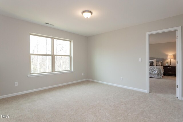 6700 Hardwick Ln, Sims, NC 27880 - unfurnished room with light colored carpet and baseboards