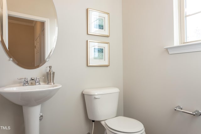 6700 Hardwick Ln, Sims, NC 27880 - half bathroom featuring toilet and crown molding