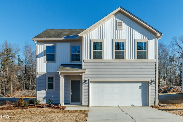 6700 Hardwick Ln, Sims, NC 27880 - view of front facade featuring an attached garage, driveway, and board and batten siding