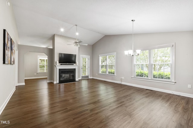 115 Heatherwood Dr, Apex, NC 27502 - unfurnished living room with healthy amount of natural light, a chandelier, baseboards, ceiling fan, and high vaulted ceiling