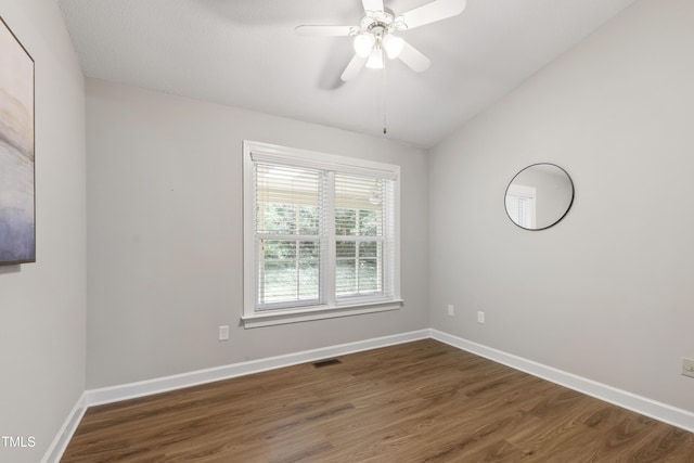 115 Heatherwood Dr, Apex, NC 27502 - spare room featuring wood finished floors, baseboards, a ceiling fan, and vaulted ceiling