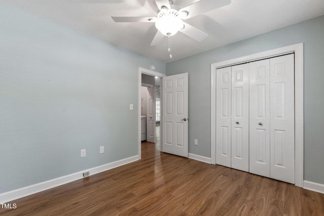 115 Heatherwood Dr, Apex, NC 27502 - unfurnished bedroom with wood finished floors, baseboards, a closet, and ceiling fan