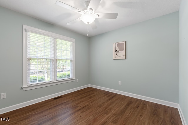 115 Heatherwood Dr, Apex, NC 27502 - spare room with plenty of natural light, dark wood-type flooring, and baseboards