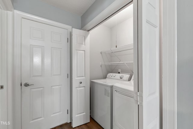 115 Heatherwood Dr, Apex, NC 27502 - washroom with washer and dryer, dark wood-style floors, and a textured ceiling