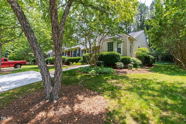 115 Heatherwood Dr, Apex, NC 27502 - view of property hidden behind natural elements with a front yard