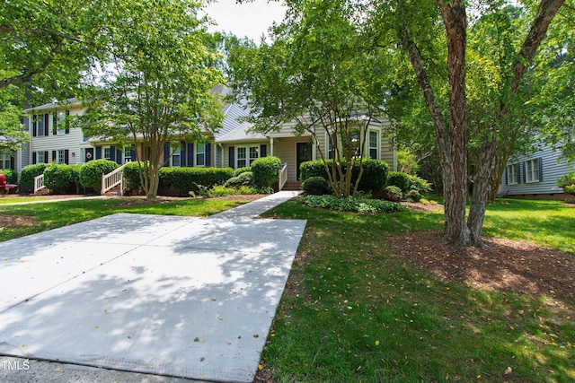 115 Heatherwood Dr, Apex, NC 27502 - view of front facade featuring a front lawn