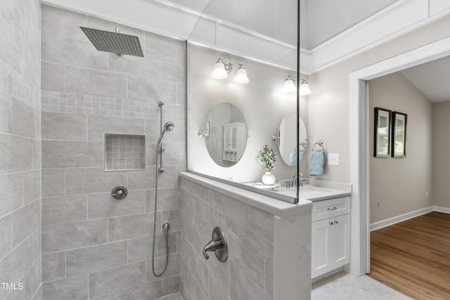 115 Heatherwood Dr, Apex, NC 27502 - full bathroom with a tile shower, vanity, and baseboards