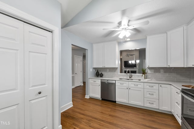115 Heatherwood Dr, Apex, NC 27502 - kitchen featuring stainless steel appliances, a sink, ceiling fan, and backsplash