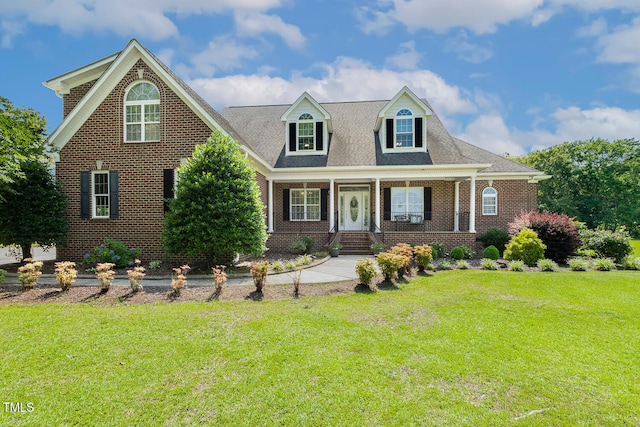 206 W Stoneybrook Ct, Benson, NC 27504 - view of front of home featuring brick siding, a front yard, and covered porch