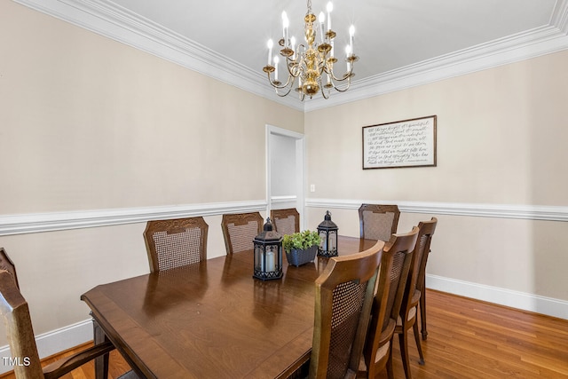 206 W Stoneybrook Ct, Benson, NC 27504 - dining space featuring a chandelier, baseboards, wood finished floors, and crown molding