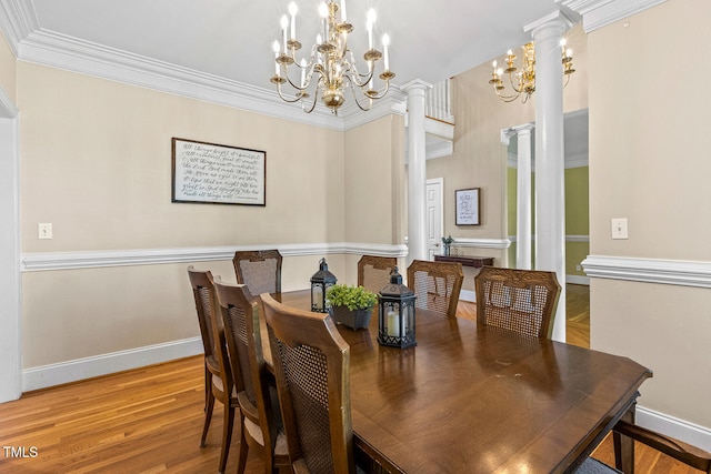 206 W Stoneybrook Ct, Benson, NC 27504 - dining space featuring a chandelier, decorative columns, baseboards, crown molding, and wood finished floors