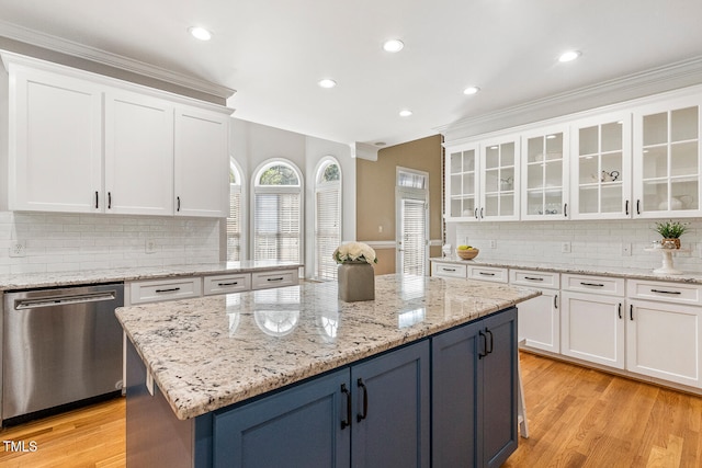 206 W Stoneybrook Ct, Benson, NC 27504 - kitchen featuring dishwasher, white cabinets, a center island, tasteful backsplash, and ornamental molding