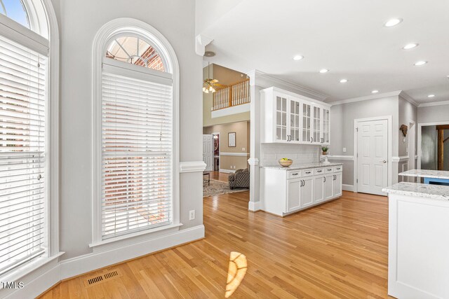 206 W Stoneybrook Ct, Benson, NC 27504 - kitchen with crown molding, white cabinets, light wood-style flooring, recessed lighting, and a ceiling fan