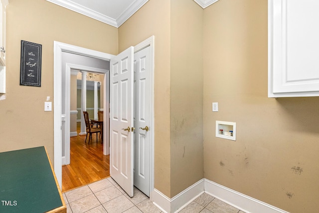 206 W Stoneybrook Ct, Benson, NC 27504 - laundry room featuring hookup for a washing machine, ornamental molding, cabinet space, light tile patterned flooring, and baseboards