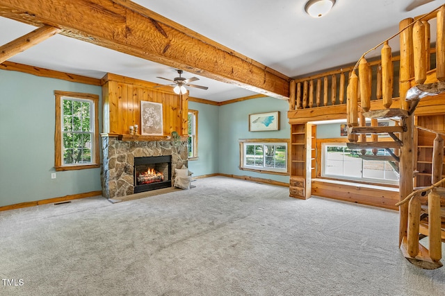 206 W Stoneybrook Ct, Benson, NC 27504 - unfurnished living room featuring carpet, a stone fireplace, ceiling fan, and baseboards