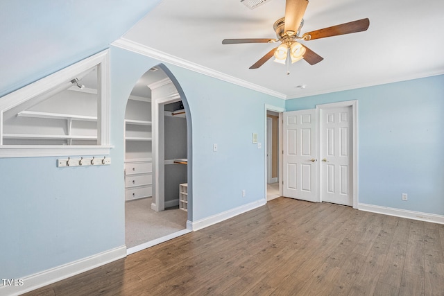 206 W Stoneybrook Ct, Benson, NC 27504 - unfurnished bedroom with wood finished floors, baseboards, arched walkways, crown molding, and ceiling fan