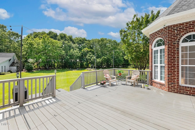 206 W Stoneybrook Ct, Benson, NC 27504 - wooden deck with a lawn and view of wooded area