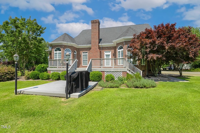 206 W Stoneybrook Ct, Benson, NC 27504 - rear view of house with a deck, brick siding, a chimney, and a yard