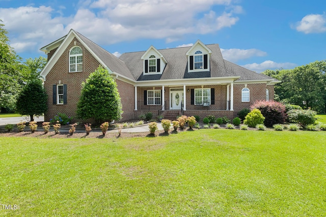 206 W Stoneybrook Ct, Benson, NC 27504 - view of front of house featuring brick siding, a front lawn, and a porch