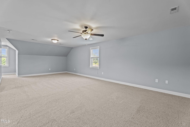 4333 US-117 Hwy, Wilson, NC 27893 - additional living space with baseboards, ceiling fan, lofted ceiling, light colored carpet, and plenty of natural light