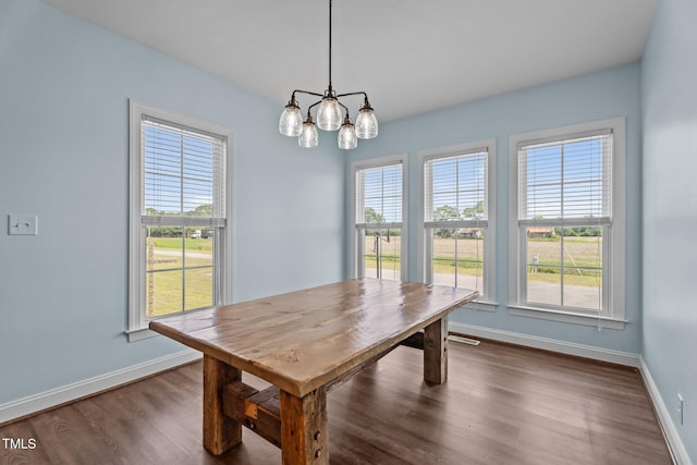 4333 US-117 Hwy, Wilson, NC 27893 - dining area with baseboards, a chandelier, and dark wood finished floors