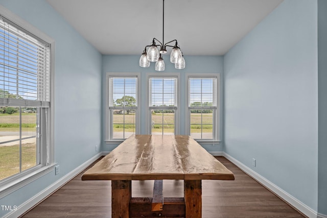 4333 US-117 Hwy, Wilson, NC 27893 - dining room featuring baseboards, dark wood-style flooring, and a chandelier