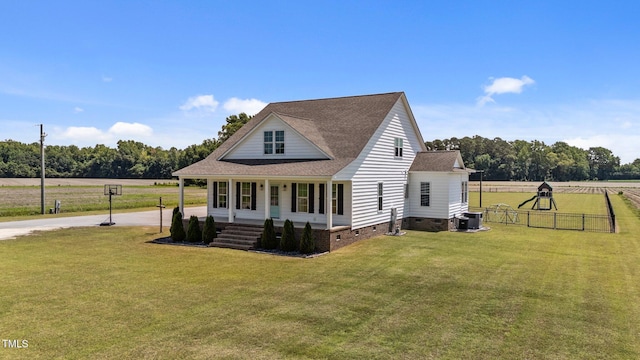 4333 US-117 Hwy, Wilson, NC 27893 - view of front of house with crawl space, covered porch, a shingled roof, central air condition unit, and driveway